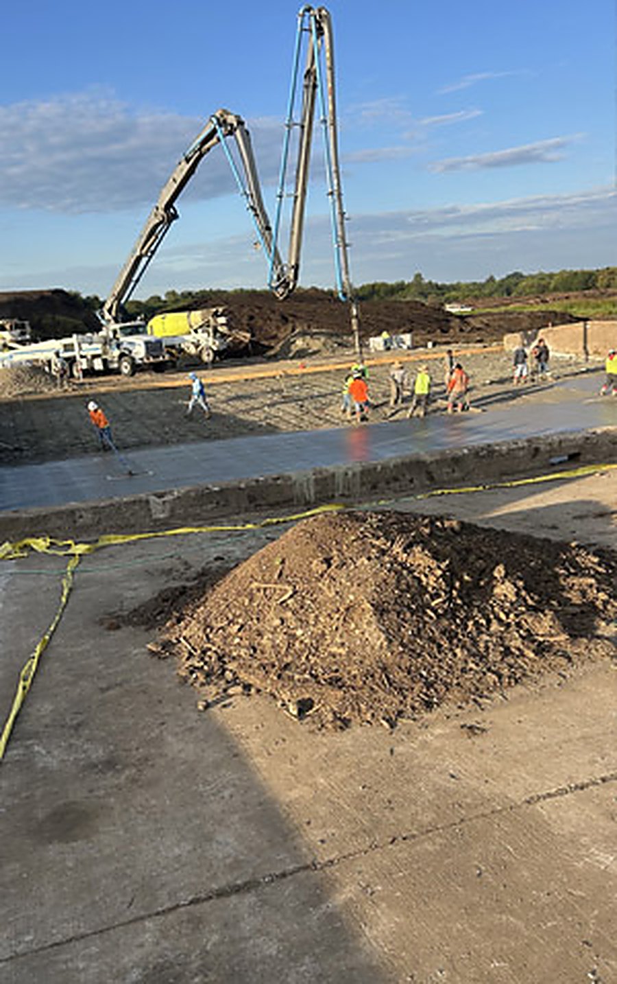 Large slab-on-grade being placed with a boom pump